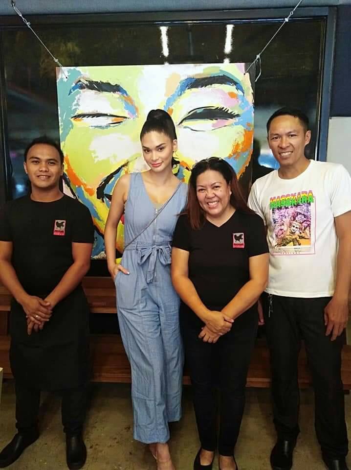 Pia Wurtzbach with the Masskara Chicken Inasal crew in front of the MassKara mural